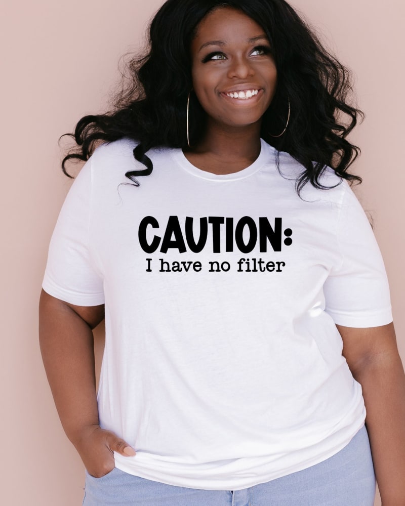 Front of a model wearing a size XL Caution I Have No Filter in White by Simply Sage Market. | dia_product_style_image_id:281395
